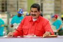 Venezuelan President Nicolas Maduro says he is raising the minimum wage to 40 bolivars, about 60 dollars at the highest official exchange rate, or $12 on the black market
