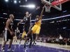 Los Angeles Lakers Kobe Bryant goes up to shoot against the San Antonio Spurs during their NBA basketball game in Los Angeles