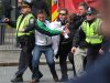 In this Monday, April 15, 2013, photo, emergency personnel carry a wounded person away from the scene of an explosion at the 2013 Boston Marathon in Boston. Two explosions shattered the euphoria of the Boston Marathon finish line on Monday, sending authorities out on the course to carry off the injured while the stragglers were rerouted away from the smoking site of the blasts. People across the country echoed strains of defiance, tenderness and wariness as Americans try to make sense of Boston bombings. (AP Photo/Kenshin Okubo)