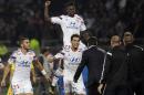 Lyon's Yoann Gourcuff, center, celebrates with his teammates after he scored a goal against Marseille during their French League One soccer match at Gerland stadium, in Lyon, central France, Sunday, Oct. 26, 2014. (AP Photo/Laurent Cipriani)