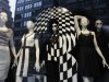 Mannequins are fashionably dressed in a Bloomingdale's store window, Thursday, Oct. 13, 2011 in New York. U.S. consumers stepped up their spending on retail goods in September, a hopeful sign for the sluggish economy. (AP Photo/Mark Lennihan)