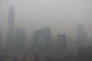 Buildings are seen in smog during a polluted day in Beijing