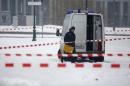 Police removes suspicious yellow postal crates near the chancellory in Berlin