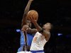 New York Knicks' J.R. Smith (8) drives past Oklahoma City Thunder's Serge Ibaka during the first half of an NBA basketball game Thursday, March 7, 2013, in New York.  (AP Photo/Frank Franklin II)