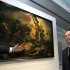 FILE - This Tuesday, Dec. 4, 2012, file photo shows France's President Francois Hollande in front of "Liberty Leading the People", a painting by Eugene Delacroix during the inauguration of the Louvre Museum in Lens, northern France. A visitor to the Louvre's newest extension, in northern France, has been detained after scrawling an inscription in marker on the famed canvas of Eugene Delacroix "Liberty Leading the People". The 28-year-old woman was immediately seized by a guard and another visitor, then handed over to police, according to a statement from the Louvre-Lens on Friday Feb 8 2013. It said the painting should be easily cleaned. (AP Photo/Michel Spingler, File)
