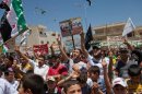 Syrians shout slogans during an anti-government demonstration after Friday prayers
