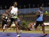 Bolt crosses the finish line during the men's 200 meters semi-final event at the Jamaican Olympic trials in Kingston city