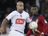 Lille's Salomon Kalou challenges Toulouse's Aymen Abennour during their French Ligue Cup soccer match at the Lille Grand Stade Stadium in Villeneuve d'Ascq