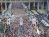 Runners fill the street at the start of the Tokyo Marathon in Tokyo