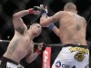 Cain Velasquez, left, throws a punch against Antonio Silva in the first round of the UFC 160 mixed martial arts heavyweight title bout, Saturday, May 25, 2013, in Las Vegas. Velasquez won by technical knockout. (AP Photo/Julie Jacobson)