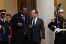 French President Hollande accompanies Chad's President Deby after a meeting at the Elysee Palace in Paris