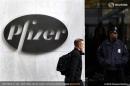 A man walks past the Pfizer logo next to a New York Police Officer standing outside Pfizer's world headquarters in New York