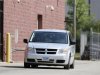 A Dodge Caravan carrying Russell Wasendorf Sr. exits from the back entrance of the United States Federal Court of the Northern District of Iowa in Cedar Rapids
