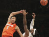 Syracuse's Michael Carter-Williams, left, and Pittsburgh's J.J. Moore fight for a rebound during the first half of an NCAA college basketball game at the Big East Conference tournament, Thursday, March 14, 2013 in New York. (AP Photo/Mary Altaffer)