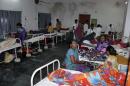 Women who underwent botched sterilization surgeries at a government mass sterilization "camp" receive treatment at a district hospital in Bilaspur