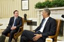 President Barack Obama welcomes British Prime Minister David Cameron in the Oval Office of the White House in Washington, Monday, May 13, 2013, for talks on subjects ranging from Syria's civil war to preparations for a coming summit of the world's leading industrial nations in Northern Ireland. (AP Photo/J. Scott Applewhite)