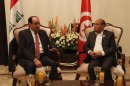 Iraqi Prime Minister Nuri al-Maliki meets with Tunisia's President Moncef Marzoukiin Baghdad