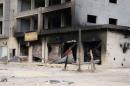 A damaged building is pictured after clashes between rival militias, in an area at Alswani road in Tripoli