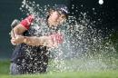 Phil Mickelson hits from a sand trap on the 15th hole during the first round of the Wells Fargo Championship golf tournament at Quail Hollow Club in Charlotte, N.C., Thursday, May 14, 2015. (AP Photo/Bob Leverone)