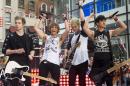 FILE - In this Tuesday, July 22, 2014 file photo, 5 Seconds of Summer band members, from left, Luke Hemmings, Ashton Irwin, Michael Clifford and Calum Hood appear on NBC's "Today" show in New York. On Saturday morning, July 26, 2014, the pop-rock band gave its fans a surprise by personally selling tickets for an upcoming concert in Inglewood, Calif. (Photo by Charles Sykes/Invision/AP)