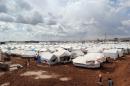 A general view shows tents at the Bab al-Salam refugee camp in the countryside of Aleppo near the Syria-Turkey border on March 12, 2014
