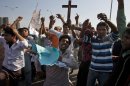 Pakistani Christians chant slogans during a demonstration demanding that the government rebuild their homes after they were burned down following an alleged blasphemy incident, in Islamabad, Pakistan, Sunday, March 10, 2013. The incident in Lahore began on Friday, March 8, 2013 after a Muslim accused a Christian man of blasphemy, an offence that in Pakistan is punished by life in prison or death. (AP Photo/Anjum Naveed)