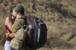 An Israeli soldier kisses his girlfriend before he &hellip;