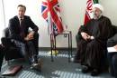 British Prime Minister David Cameron (L) meets Iranian President Hassan Rouhani at the UN during the 69th Session of the UN General Assembly in New York on September 24, 2014