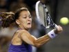 Radwanska of Poland returns a shot against Kerber of Germany during their semi-final singles match at the Pan Pacific Open tennis tournament in Tokyo