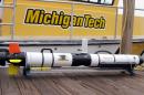 This undated photo proved by Michigan Technological University shows an Iver 3 Autonomous Underwater Vehicle purchased by Enbridge Energy Partners for Michigan Technological University in Houghton, Mich. Michigan Tech's Great Lakes Research Center will use the device to conduct sonar inspections of Enbridge oil pipelines beneath the Straits of Mackinac. Some consider the pipes, laid in 1953, a symbol of the dangers lurking in the nation's sprawling web of buried oil and natural gas pipelines. (AP Photo/Michigan Technological University, Guy Meadows)
