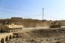 Tanks of Iraqi army take part in an operation against Islamic State militants southeast of Mosul