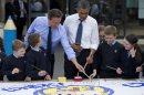 President Barack Obama and British Prime Minister David Cameron help students paint a mural during a visit to the Enniskillen Integrated Primary School in Enniskillen, Northern Ireland, Monday, June 17, 2013. The visit takes place before leaders from the G-8 nations are to gather to discuss the ongoing conflict in Syria, and free-trade issues. (AP Photo/Evan Vucci)