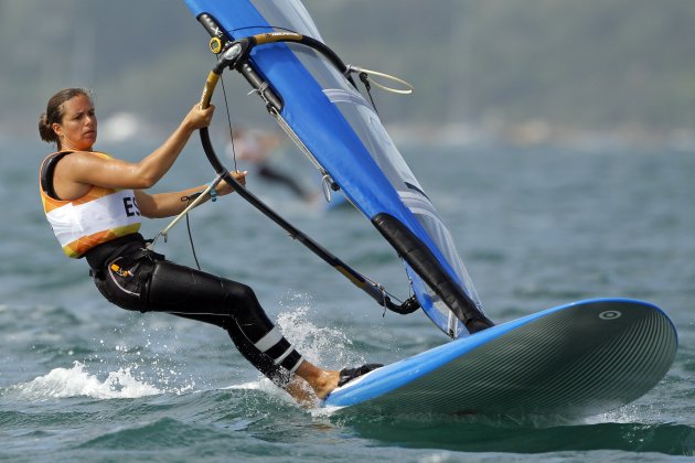 Spain's Marina Alabau stands on her windsurfing board during the sixth race of the women's RS-X sailing class at the London 2012 Olympic Games