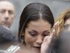 Karima el-Mahroug, also known as Ruby, a Moroccan woman at the center of ex-Premier Silvio Berlusconi's sex-for-hire trial, wipes away a tear as she reads a statement to reporters during a protest outside the court house, in Milan, Italy, Thursday, April 4, 2013. The Moroccan woman at the center of ex-Premier Silvio Berlusconi's sex-for-hire trial has denounced what she says is psychological warfare being waged against her by Italian prosecutors. Ruby, read out a lengthy statement Thursday to a gaggle of reporters in front of Milan's courthouse denying she was a prostitute and insisting that prosecutors hear her side of the story. (AP Photo/Luca Bruno)