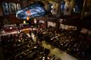 "Flight", an art installation by British artist Arabella Dorman, shows a capsized boat, complete with life jackets, used by refugees to get to the Greek island of Lesbos, suspended in the nave of St. James's Church in London, on December 21, 2015