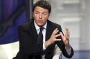 Italy's PD leader Renzi gestures as he appears as a guest on the RAI television show Porta a Porta in Rome