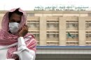A man, wearing a surgical mask as a precautionary measure against the novel coronavirus, walks near a hospital in Khobar city in Dammam