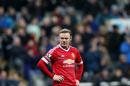 Manchester United's captain Wayne Rooney stands dejected after missing a chance to score during the English Premier League soccer match between Newcastle United and Manchester United at St James' Park, Newcastle, England, Tuesday, Jan. 12, 2015. (AP Photo/Scott Heppell)