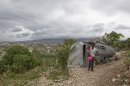 Residents of a camp for displaced people of the 2010 earthquake voluntarily remain in their camp homes as tropical Storm Isaac bears down on Port au Prince