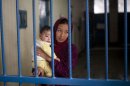 Picture taken March 28, 2013 shows Afghan female prisoner Nuria with her infant boy at Badam Bagh, Afghanistan's central women's prison, in Kabul, Afghanistan. 