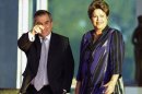 Brazilian President Dilma Rousseff (R) waits with Gilberto Carvalho, at Alvorada Palace, in Brasilia, September 2, 2013