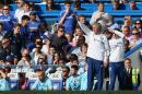 Chelsea manager Jose Mourinho gestures as he watches their English Premier League soccer match against Norwich City at Stamford Bridge stadium in London, Sunday May 4, 2014. (AP Photo/Alastair Grant)