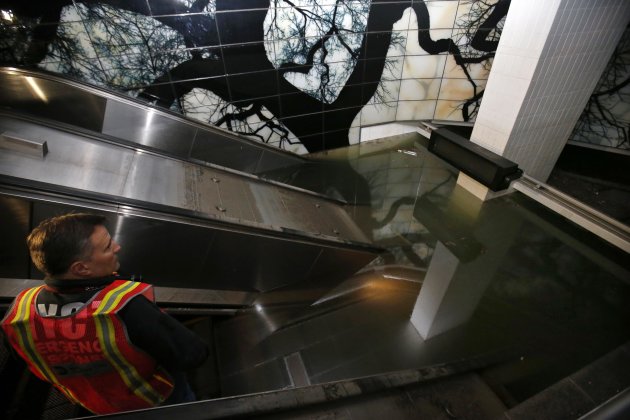 MTA Vice President Leader inspects a flooded escalator at the South Ferry-Whitehall Subway Terminal in lower Manhattan