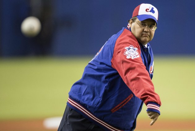 Montreal Mayor Denis Coderre fires the opening pitch prior to a pre-season exhibition baseball game game between the Toronto Blue Jays and the New Yor...