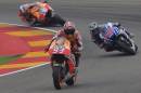 MotoGP raider Marc Marquez of Spain steers his motorcycle followed by Jorge Lorenzo and Dani Pedrosa during the MotoGP race at the Aragon Motorcycle Grand Prix in Alcaniz, Spain, Sunday, Sept. 28, 2014. (AP Photo/Manu Fernandez)
