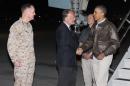 President Barack Obama, right, is greeted by US Ambassador to Afghanistan James Cunningham, center, and Marine General Joseph Dunford, commander of the US-led International Security Assistance Force (ISAF), as he steps off Air Force One after arriving at Bagram Air Field for an unannounced visit, on Sunday, May 25, 2014, north of Kabul, Afghanistan. (AP Photo/ Evan Vucci)