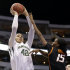 Baylor center Brittney Griner (42) attempts a shot over Oklahoma State' Toni Young (15) in the first half of an NCAA college basketball game in the Big 12 women's tournament on Sunday, March 10, 2013, in Dallas. (AP Photo/Tony Gutierrez)