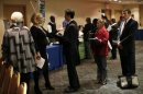 Job seekers wait to meet with employers at a career fair in New York City