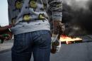 A Shiite protester holds a petrol bomb during 2013 clashes with Bahraini riot police in the village of Malikiyah