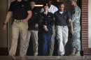 Private First Class Bradley Manning is escorted out of court after testifying in the sentencing phase of his military trial at Fort Meade